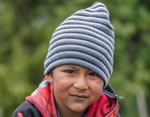 A young child wearing a hat.